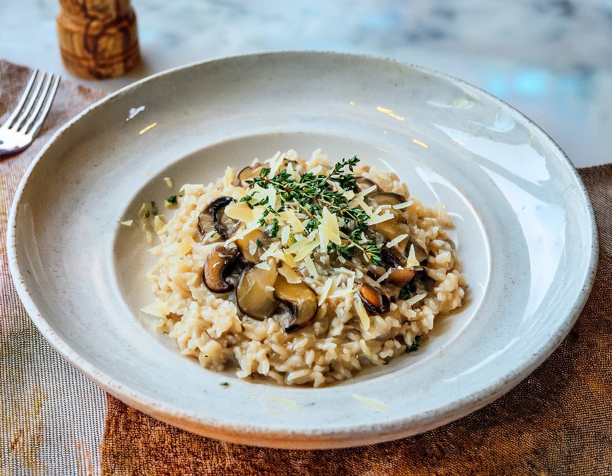 Creamy mushroom risotto with parmesan and thyme Ⓥ