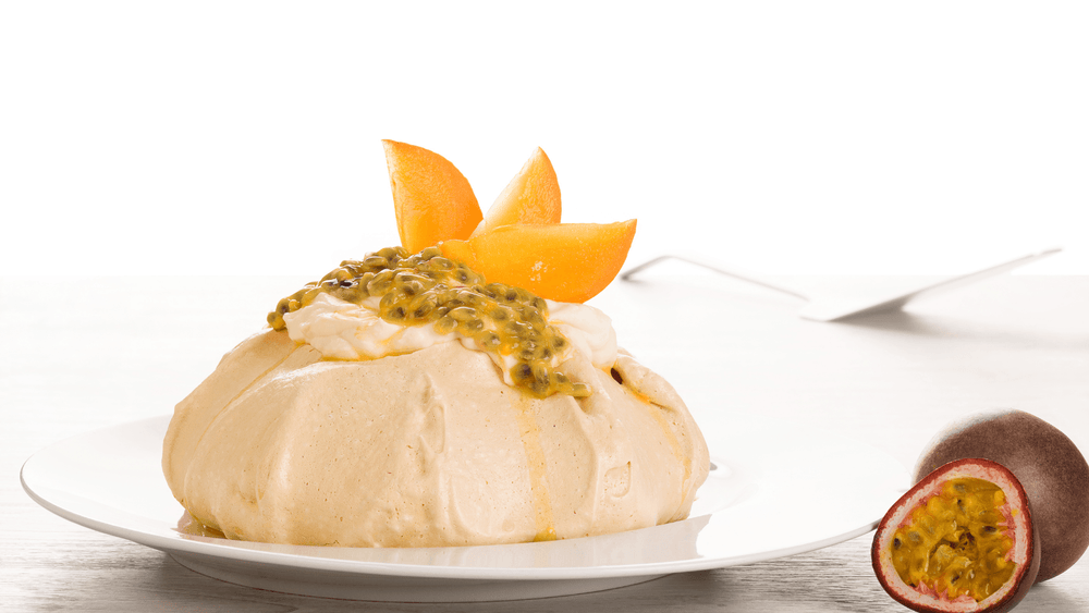 Pavlova with kiwi and passion fruit